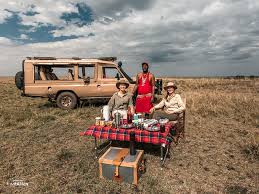 Budget Safari Kenya: The Best Wild Ultimate Adventures 2026 1 Evening bonfire at Rhino Tourist Camp after a full day masai mara budget safari